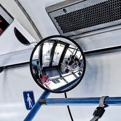 Low angle view of bicycle wheel against wall