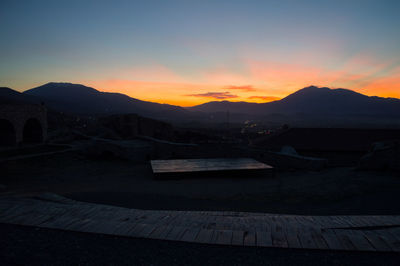 Scenic view of mountains against sky during sunset