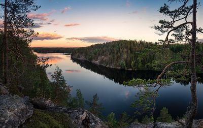 Scenic view of lake against sky at sunset