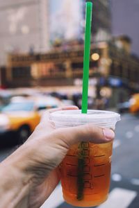 Close-up of hand holding drink