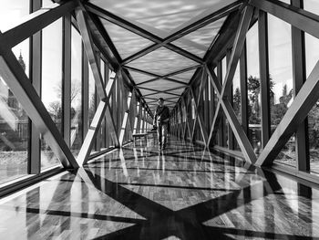 Full length of man walking on bridge