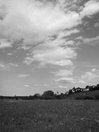 Scenic view of agricultural field against sky