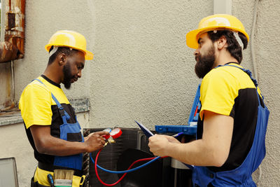 Side view of man working at construction site