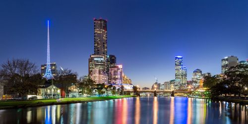 Illuminated city at waterfront
