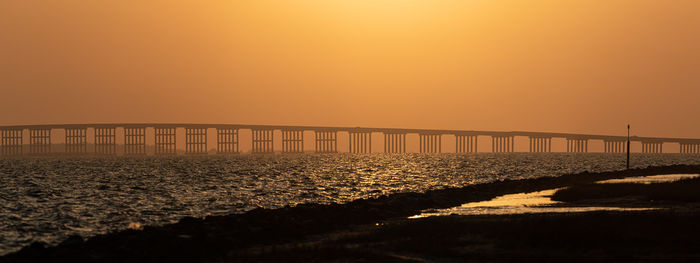 Full frame view of bridge and clear orange sky before sunset