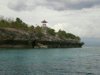 Scenic view of sea against cloudy sky