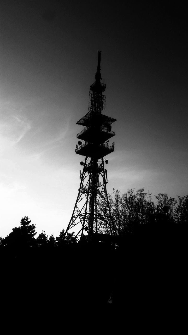 silhouette, low angle view, tree, tower, communication, architecture, outdoors, sky, no people, built structure, sunset, day, global communications, technology, nature, building exterior