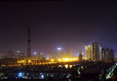 Illuminated buildings in city at night