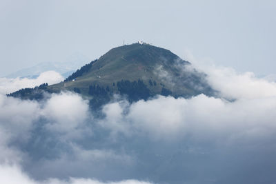 Low angle view of volcanic mountain against sky