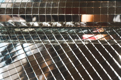 High angle view of man welding metal grate