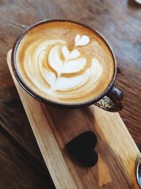 Close-up of cappuccino on table