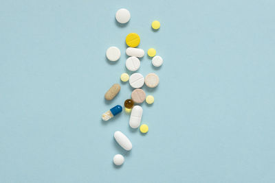 Close-up of pills on blue background