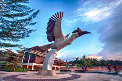 Low angle view of statue against sky