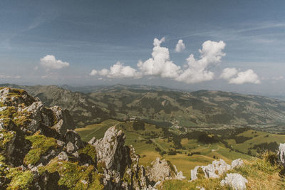 Scenic view of landscape against cloudy sky