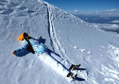 High angle view of person skiing on snowcapped mountain
