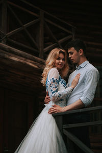 Couple standing at cottage