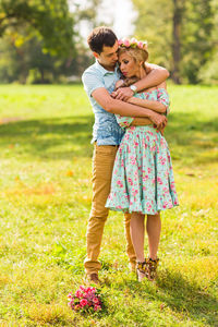 Young couple standing on grass