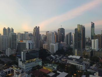 High angle view of buildings in city against sky during sunset