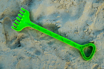 View of shovel on sand