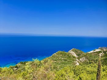 Scenic view of sea against clear blue sky