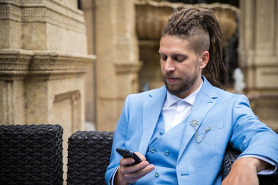 Young man using mobile phone