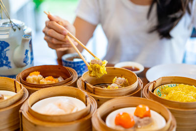 Midsection of woman preparing food