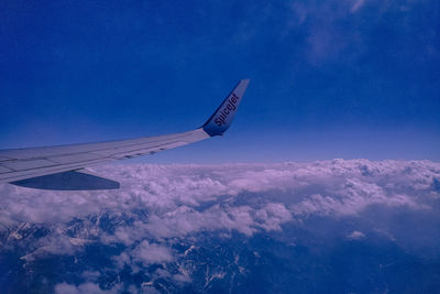 Low angle view of airplane flying in sky