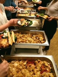 Midsection of man preparing food