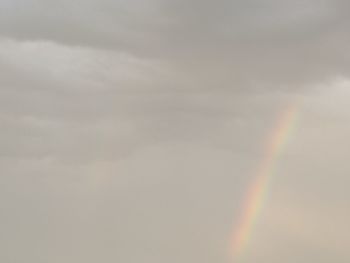 Low angle view of rainbow against sky