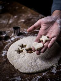 Midsection of person preparing food on table