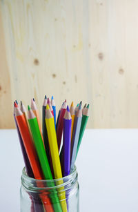 Close-up of multi colored pencils on table