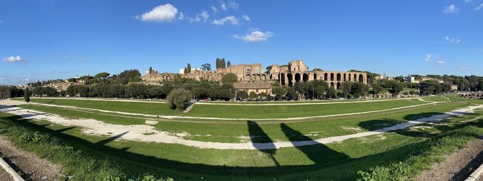 Panoramic view of the circus maximo against blue sky