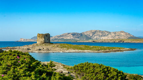 Scenic view of sea against clear blue sky