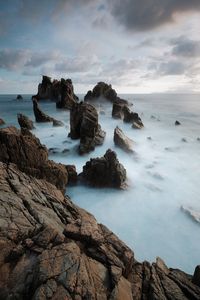 Scenic view of sea against sky at sunset