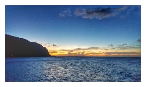 Scenic view of sea against sky at sunset