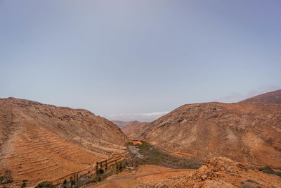 Scenic view of desert against clear sky