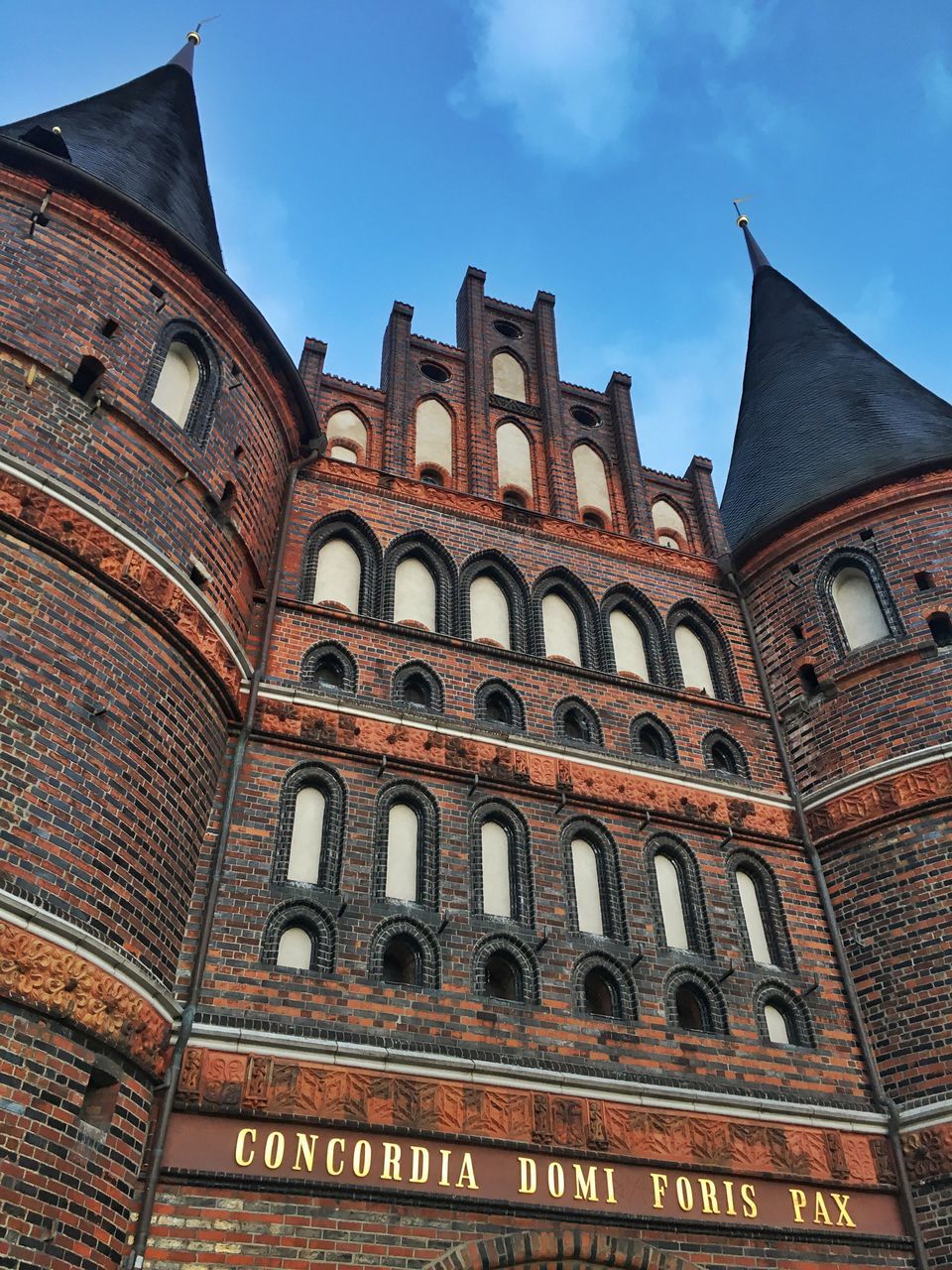 architecture, low angle view, built structure, building exterior, sky, travel destinations, city, no people, tourism, history, tower, arch, outdoors, day, cultures, clock tower