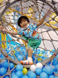 Portrait of cute little boy playing