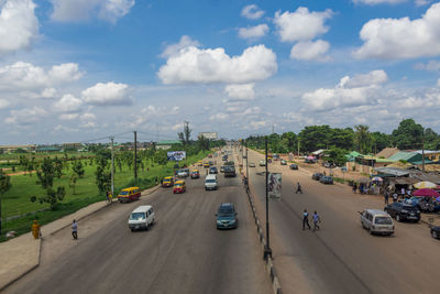 High angle view of vehicles on road against sky