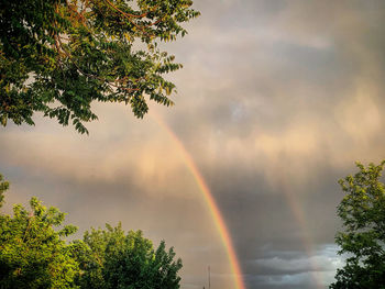 Low angle view of rainbow against sky