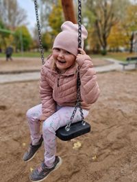 Girl swinging at playground