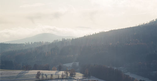 Scenic view of mountains against sky during winter