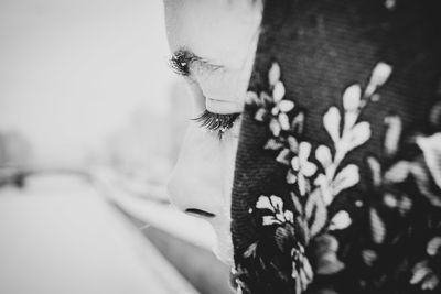 Close-up of woman in headscarf during winter