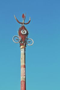 Low angle view of built structure against clear blue sky