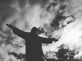 Low angle view of statue against cloudy sky