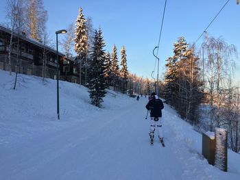 Person skiing in snow against sky