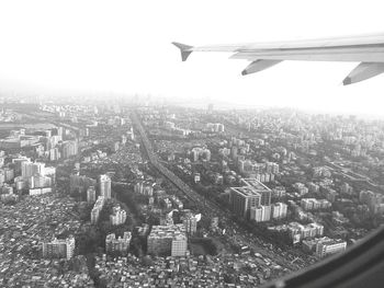 Aerial view of cityscape against clear sky