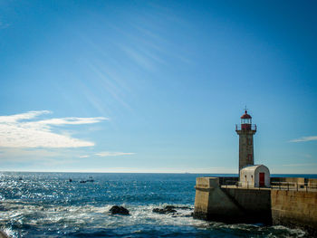 Scenic view of sea against blue sky