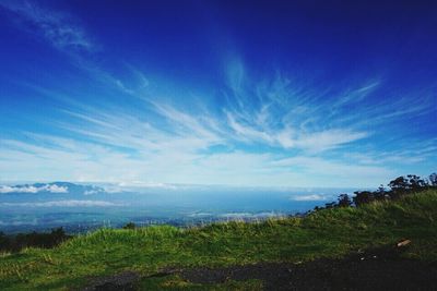 Scenic view of landscape against cloudy sky