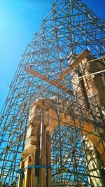 Low angle view of construction site against sky